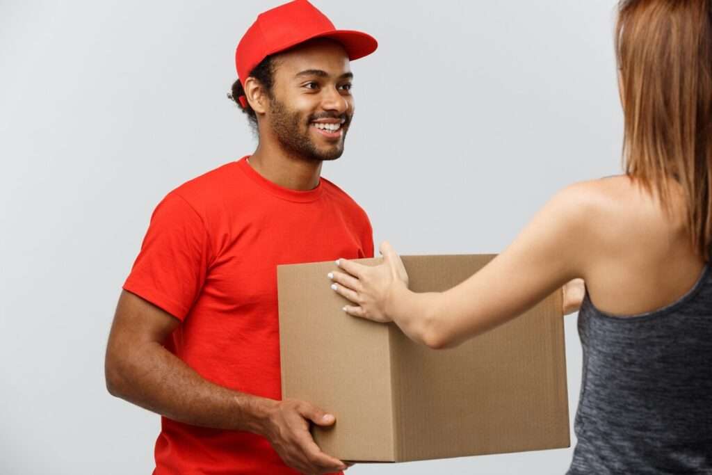 How to optimize routes with Google - Delivery Concept Handsome African American Delivery Man Giving Package Homeowner Isolated Grey Studio Background Copy Space 1258 1213 1024x683 